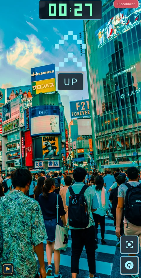 An UP command lifts the camera from the crowded crossing to the sunset sky.